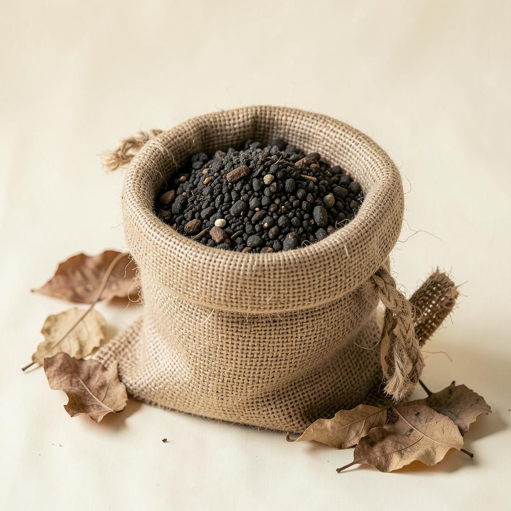 Organic granular fertilizer in a jute sack with dried leaves
